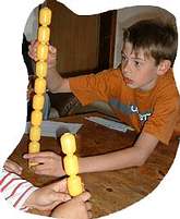 Build the highest free standing tower from approx. 15-20 Kinder Eggs (or plastic contents eggs).