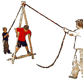 A large wooden A frame is held with 2 ropes. One person stands in the A and moves it forwards.