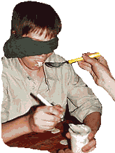Two players are blindfolded and must feed each other with apple sauce.