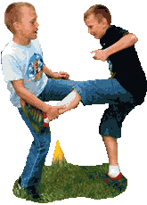 2 kids hold out their hands and each hold onto the other player’s stretched out leg with their other hand.