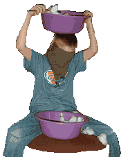 The player is blindfolded and has a bowl full of cotton balls on his lap.