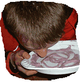 A plate is filled with water, apple sauce or yogurt and must be slurped up by the player.